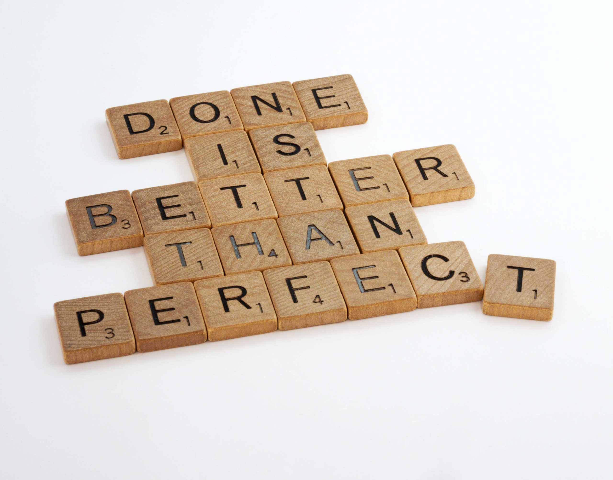 Scrabble tiles spelling out: Done Is Better Than Perfect
